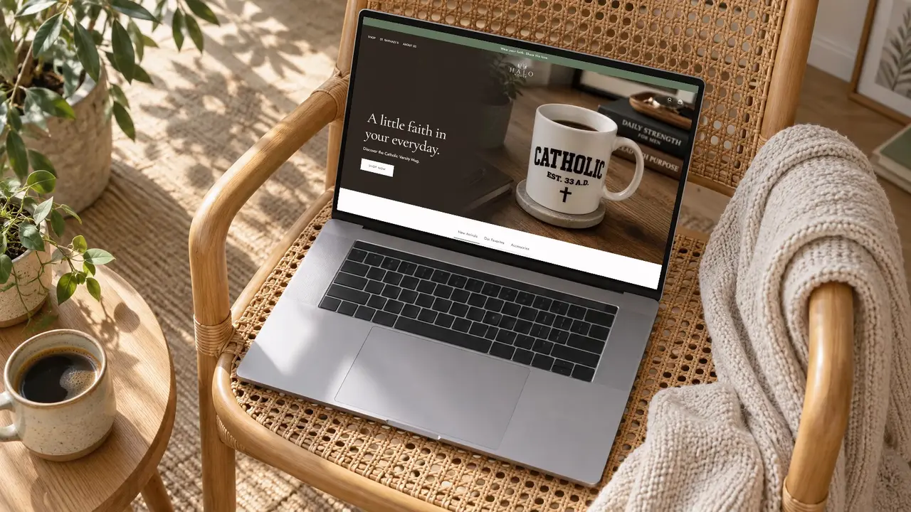The Halo House storefront open on a laptop resting on a rattan chair